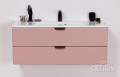 Szafka łazienkowa w kolorze pudrowego różu z białą umywalką