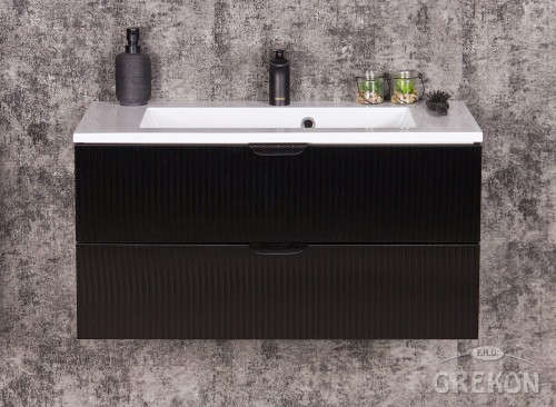 Modułowa szafka łazienkowa w czarnym kolorze wraz z białą umywalką