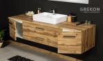 Elegancka szafka łazienkowa w kolorze naturalny dąb z białą nablatową umywalką