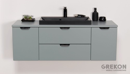 Matowa miętowa szafka łazienkowa z czarną nablatową umywalką