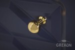 Złoty uchwyt w kształcie gałki